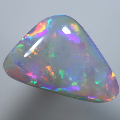 SOLID SEMI BLACK OPAL Large neon rolling flashes of red and orange
